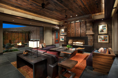 Formal open plan living room in Phoenix with brown walls, a ribbon fireplace, black floors and a wood ceiling.