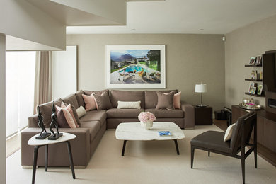Trendy enclosed carpeted living room photo in London with brown walls and a wall-mounted tv