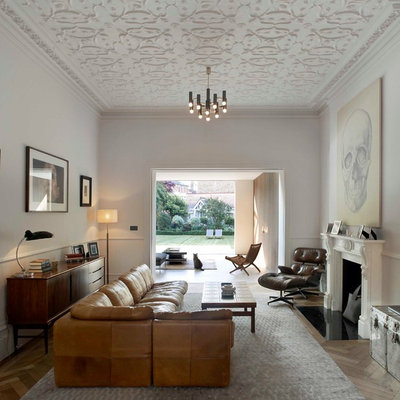 Living room - transitional living room idea in London with a standard fireplace