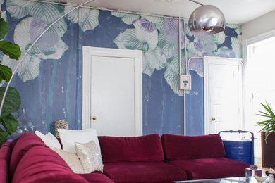 This is an example of a medium sized world-inspired living room in Los Angeles with multi-coloured walls.