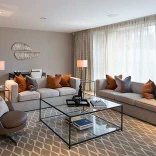 Inspiration for a traditional formal living room in London with grey walls, light hardwood flooring and brown floors.