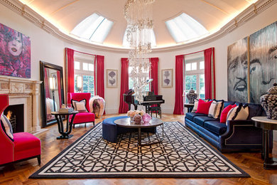 Large contemporary formal mezzanine living room in London with beige walls and brown floors.