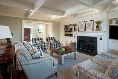 Photo of a large classic formal enclosed living room in Philadelphia with white walls, a standard fireplace, a built-in media unit, carpet, a stone fireplace surround and grey floors.