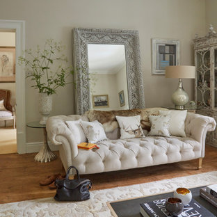Photo of a large enclosed living room in Other with beige walls, medium hardwood flooring and brown floors.