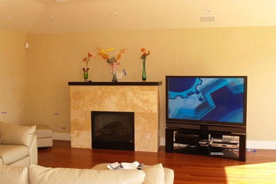Example of a mid-sized transitional formal dark wood floor and brown floor living room design in Other with beige walls, a standard fireplace, a tile fireplace and a tv stand