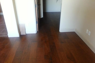 Inspiration for a medium tone wood floor living room remodel in Phoenix