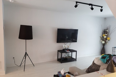 Minimalist living room photo in Montreal