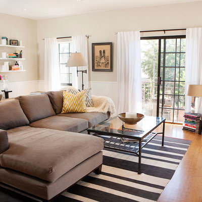 Example of a transitional living room design in Los Angeles with beige walls