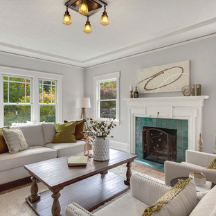 Example of a mid-sized arts and crafts formal medium tone wood floor living room design in Seattle with gray walls, a standard fireplace, a tile fireplace and no tv
