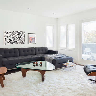 Example of a transitional formal and enclosed dark wood floor living room design in Vancouver with white walls
