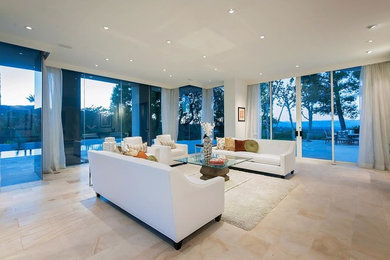 Example of a large trendy formal and open concept ceramic tile and beige floor living room design in Los Angeles with white walls, no fireplace and no tv
