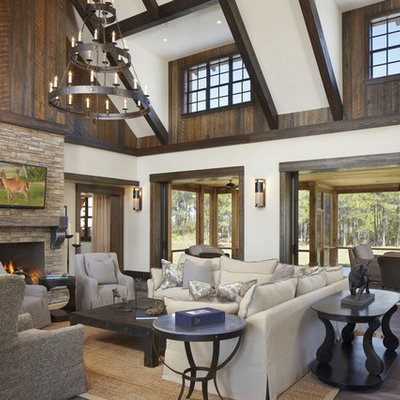 Mountain style formal and open concept living room photo in Miami with a standard fireplace and a stone fireplace