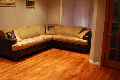 Example of a medium tone wood floor living room design in Ottawa