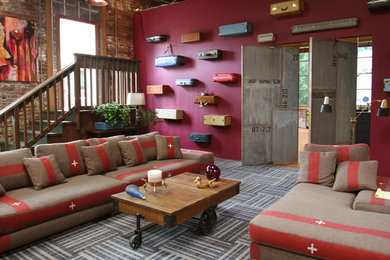 Inspiration for an industrial living room remodel in Portland with red walls