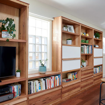 Reclaimed timber bookcase across living and dining room
