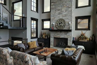 Example of a mid-sized mountain style open concept and formal carpeted and gray floor living room design in Salt Lake City with gray walls, a standard fireplace, a stone fireplace and no tv