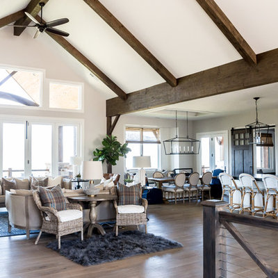 Inspiration for a large cottage open concept medium tone wood floor living room remodel in Salt Lake City with white walls, a standard fireplace, a stone fireplace and a wall-mounted tv