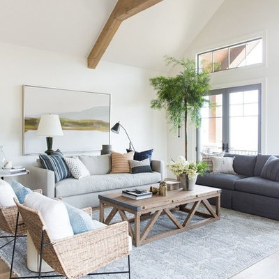 Large country open concept light wood floor and beige floor living room photo in Salt Lake City with white walls