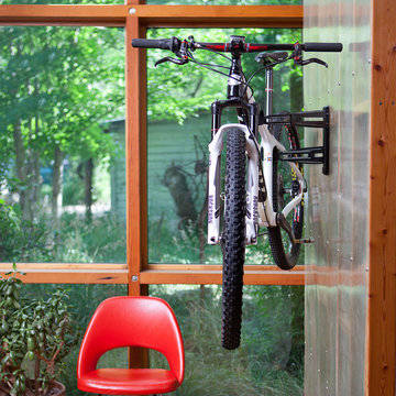 Reduces the bulk of your bike by getting it closer to the wall.