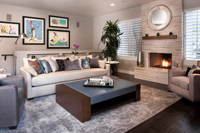 Example of a transitional dark wood floor living room design in Phoenix with gray walls, a standard fireplace and a stone fireplace