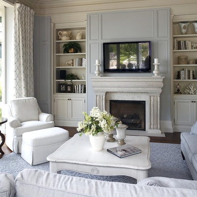 Living room - traditional living room idea in Burlington with blue walls and a wall-mounted tv