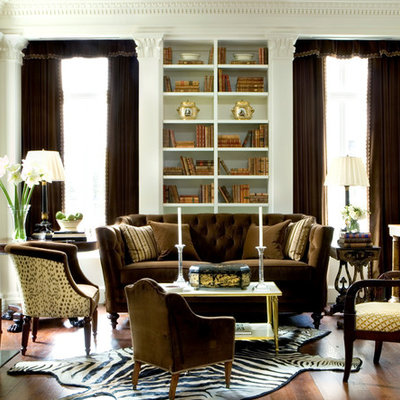 Living room - mid-sized traditional formal and enclosed medium tone wood floor living room idea in Atlanta with white walls, a standard fireplace and no tv