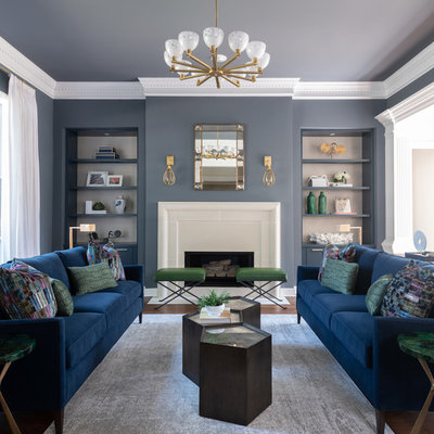 Inspiration for a transitional dark wood floor and brown floor living room remodel in Dallas with gray walls and a standard fireplace