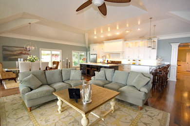 Large elegant open concept dark wood floor living room photo in Charleston with blue walls, a standard fireplace and no tv