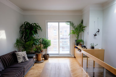 Minimalist living room photo in Montreal