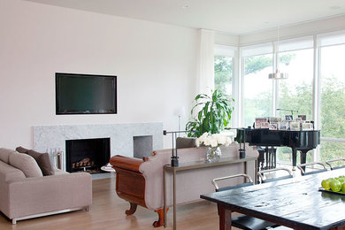 Example of a large minimalist open concept light wood floor living room design in Nashville with a music area, white walls, a standard fireplace, a stone fireplace and a wall-mounted tv
