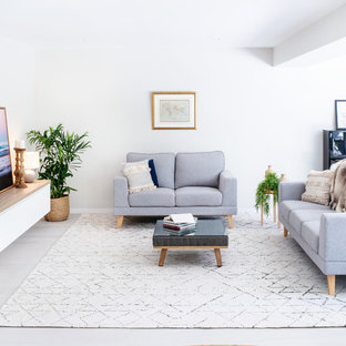 Photo of a contemporary formal open concept living room in Brisbane with white walls, no tv and beige floor.