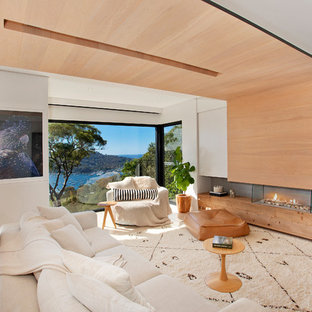 Design ideas for a large contemporary open concept living room in Sydney with white walls, a standard fireplace and a wood fireplace surround.
