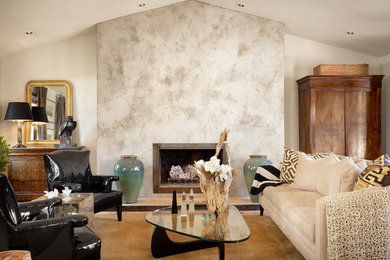 Inspiration for a contemporary living room remodel in Austin with white walls and a standard fireplace