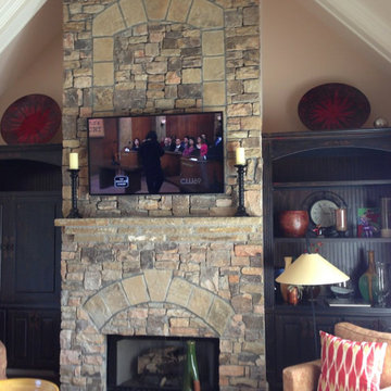 Residential TV Installation over Stacked Stone Fireplace