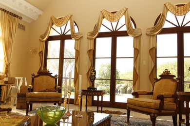 Huge elegant formal and open concept marble floor living room photo in Orange County with beige walls