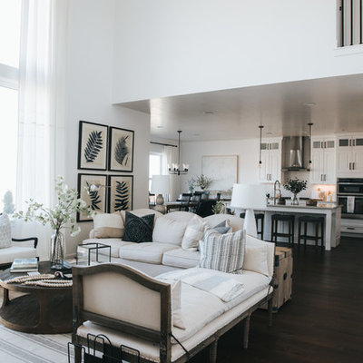 Living room - country dark wood floor and brown floor living room idea in Salt Lake City with white walls
