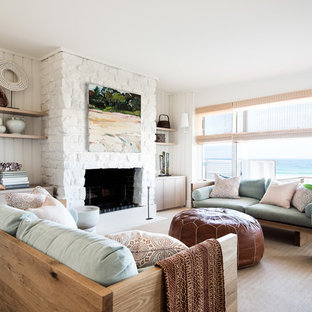 Inspiration for a beach style formal enclosed living room in Sydney with white walls, carpet, a standard fireplace, a stone fireplace surround and beige floor.