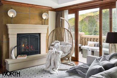 デンバーにある中くらいなコンテンポラリースタイルのおしゃれなLDK (グレーの壁、標準型暖炉、コンクリートの暖炉まわり) の写真