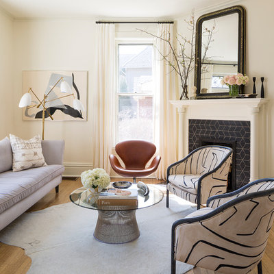 Example of an ornate formal and enclosed medium tone wood floor living room design in Chicago with white walls, a corner fireplace and a tile fireplace