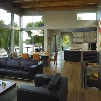 Example of a trendy open concept living room design in Seattle with beige walls