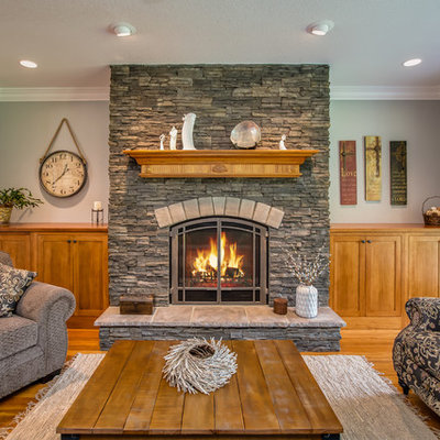 Mid-sized mountain style formal and enclosed medium tone wood floor living room photo in Atlanta with a standard fireplace, a stone fireplace and no tv