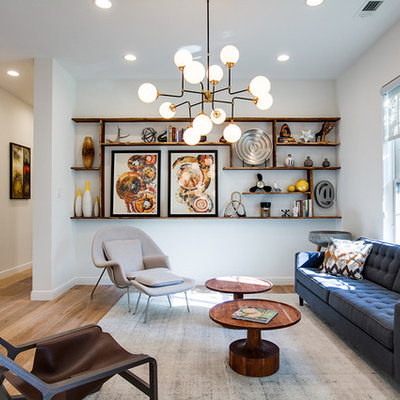 Inspiration for a large contemporary formal and open concept light wood floor living room remodel in Dallas with white walls, no fireplace and no tv