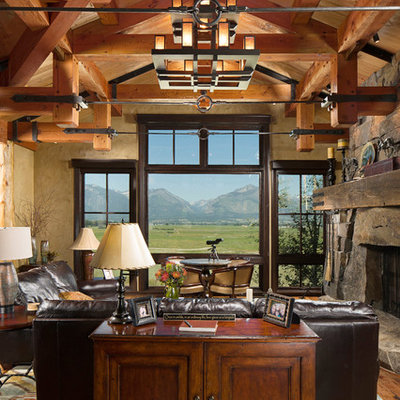 Living room - mid-sized rustic open concept and formal medium tone wood floor and brown floor living room idea in Other with beige walls, a standard fireplace, a stone fireplace and no tv