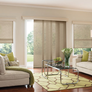 Example of a mid-sized minimalist open concept medium tone wood floor living room design in Denver with beige walls