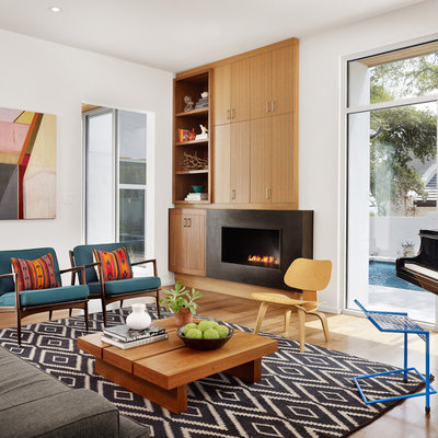 Example of a trendy living room design in Austin with a music area and a ribbon fireplace