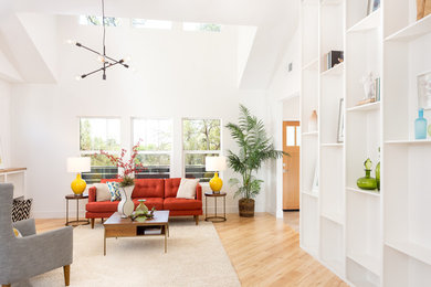 Inspiration for a mid-sized contemporary open concept light wood floor living room remodel in Sacramento with white walls
