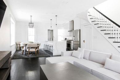 Living room - dark wood floor and black floor living room idea in New York with white walls
