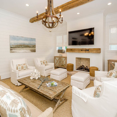 Living room - coastal living room idea in Miami with white walls and a standard fireplace
