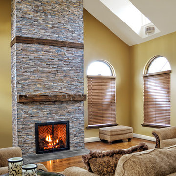 rustic fireplace in a room with high ceilings