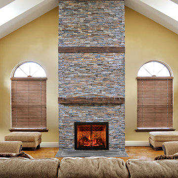 rustic fireplace in a room with high ceilings